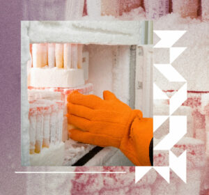 Available-Specimens Person wearing a protective glove reaching into a freezer full of bio specimens.